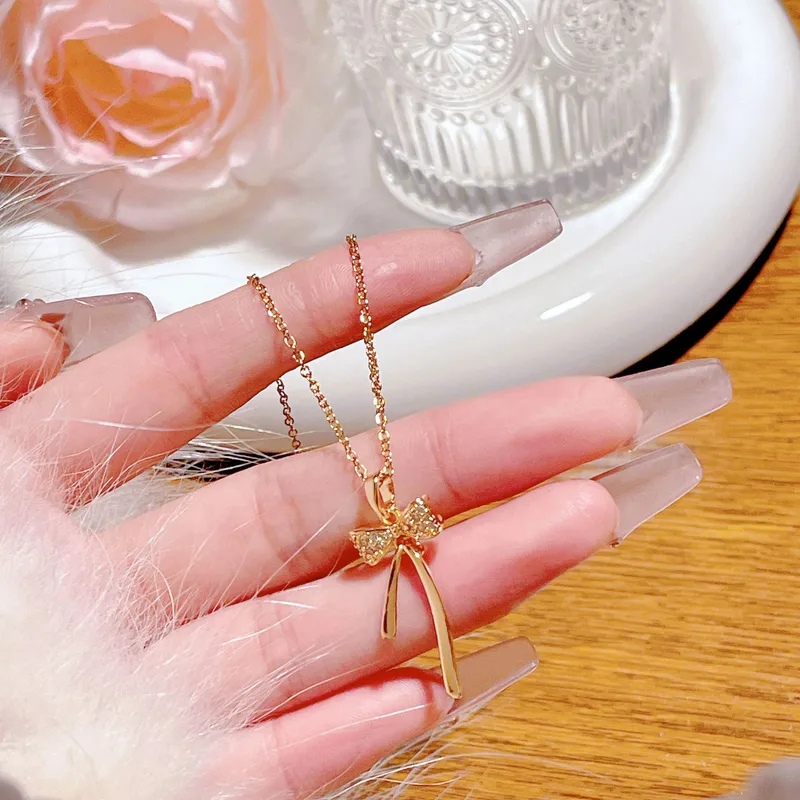 Golden Bow Necklace – Graceful Sparkle with Timeless Charm